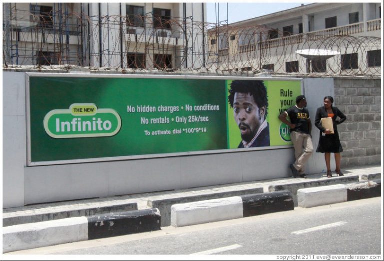 lagos victoria island maroko road man woman in front of glo billboard large 768x522 - Roadside Hoardings Advertising